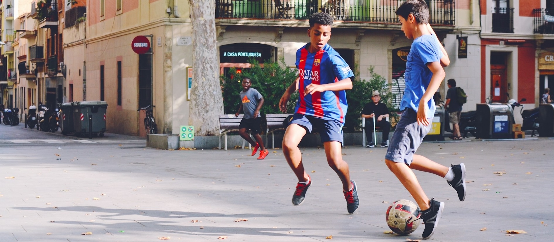 Kids playing street soccer in Europe